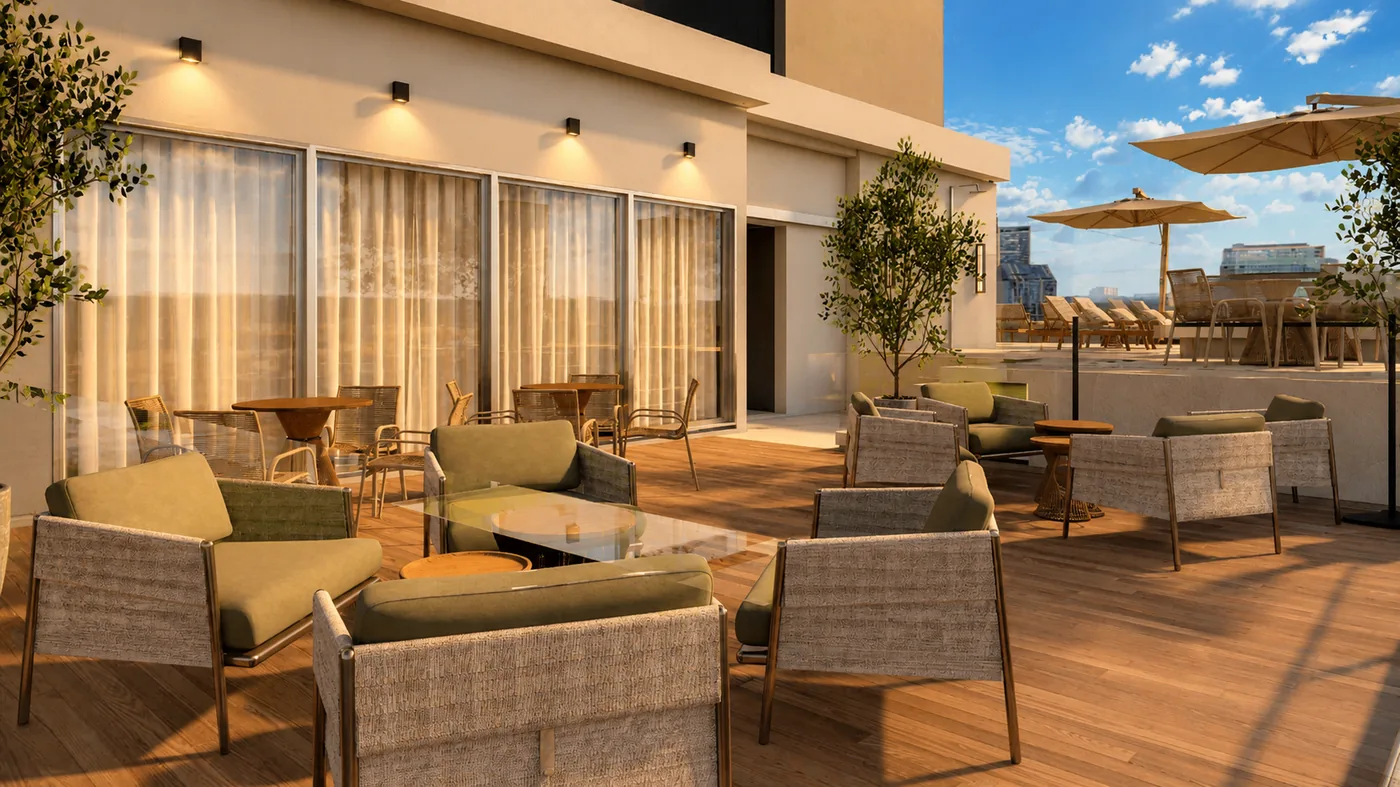 Jardins da Brava: lounge externo com poltronas e guarda-sóis