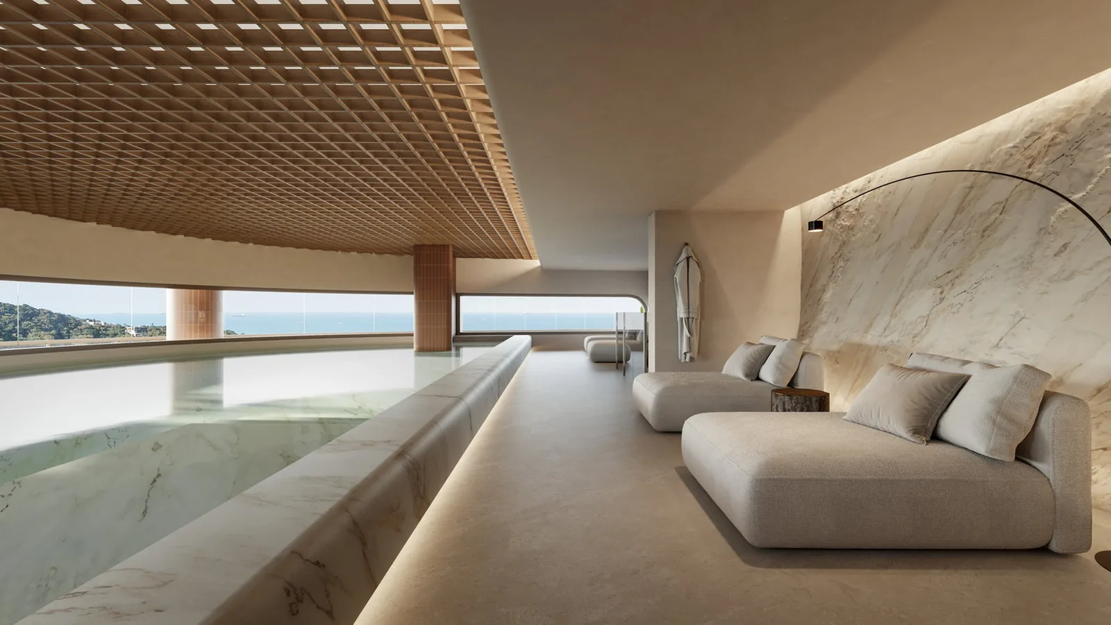 Raro Brava · interior de um studio, com a sacada aberta para o mar